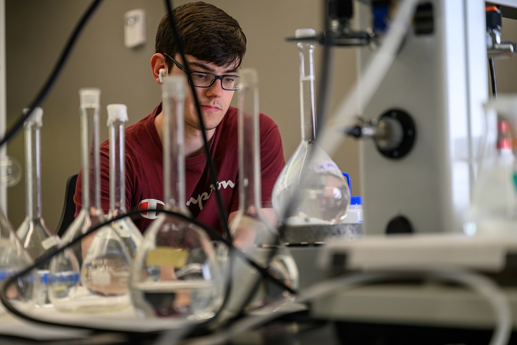 An OHIO researcher works in a lab in the Russ Research Opportunity Center