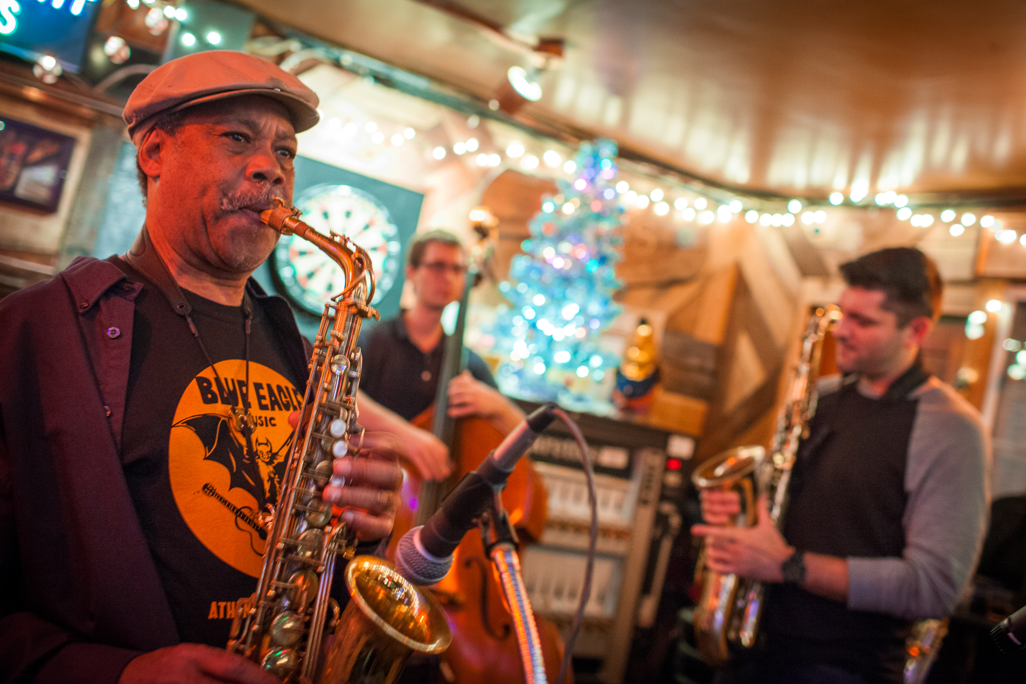A jazz band plaing in a well-lit bar